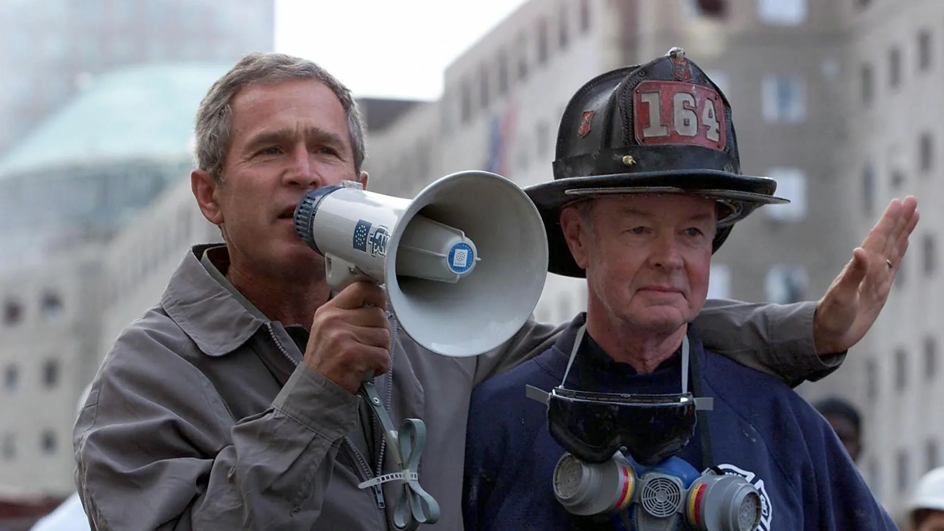President George W. Bush with a bullhorn and firefighter Bob Beckwith at Ground Zero, September 14, 2001